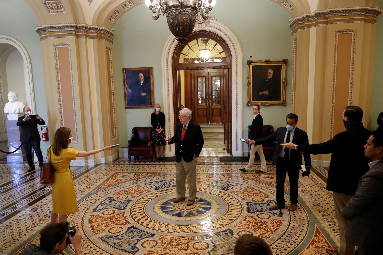 U.S. Senate Majority Leader Mitch McConnell (R-KY) speaks to members of the news media after departing from the Senate Chamber floor on Capitol Hill in Washington, U.S. , April 9, 2020. REUTERS/Tom Brenner