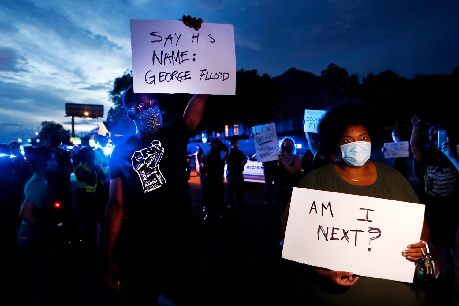 A group of demonstrators in Midtown Memphis on Wednesday protest the recent deaths of three black Americans across the country holding signs with the name of George Floyd who was killed in Minneapolis. The protest turned when a counter-protester holding a Confederate 901 sign showed up. Police closed part of Union Avenue and put up barricades to keep the two groups separated.W 28200