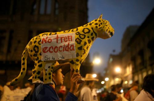 A demonstrator holds a papier-mache jaguar with a note reading " No ecocidal train" as Mexico's Zapatista National Liberation Army (EZLN) protest against the construction of the Mayan train and the Santa Lucia airport projects promoted by Mexico's government in Mexico City, Mexico, February 21, 2020. REUTERS/ Edgard Garrido     TPX IMAGES OF THE DAY