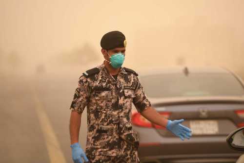TABUK, SAUDI ARABIA- Police and military carry out health checks on drivers as a preventive measure against the coronavirus in Tabuk, Saudi Arabia on April 14, 2020. King Salman of Saudi Arabia extended the curfew throughout the country until new notice due to the spread of the new Covid-19 coronavirus, as reported on Sunday (12) by the Interior Ministry. Saudi Arabia placed its capital Riyadh and other major cities under a 24-hour curfew, blocking much of the population from stopping the spread of the Covid-19 coronavirus.