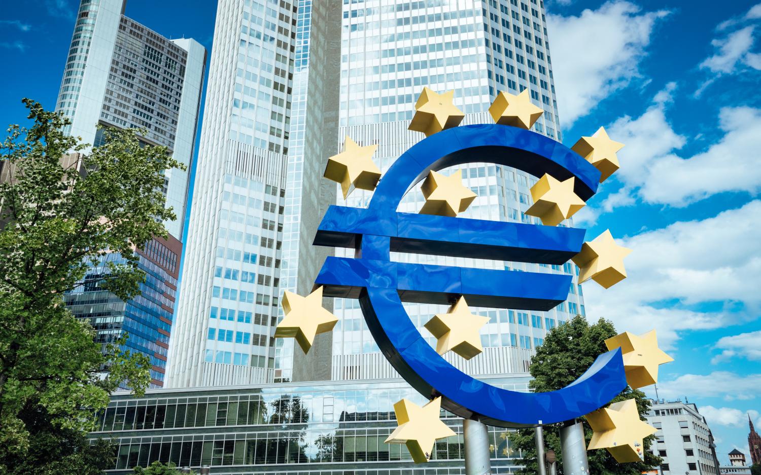 Frankfurt, Germany - August 3, 2017: Large sign for the Euro in front of the European Central Bank headquarters (Eurotower) in Frankfurt am Main on a clear day.