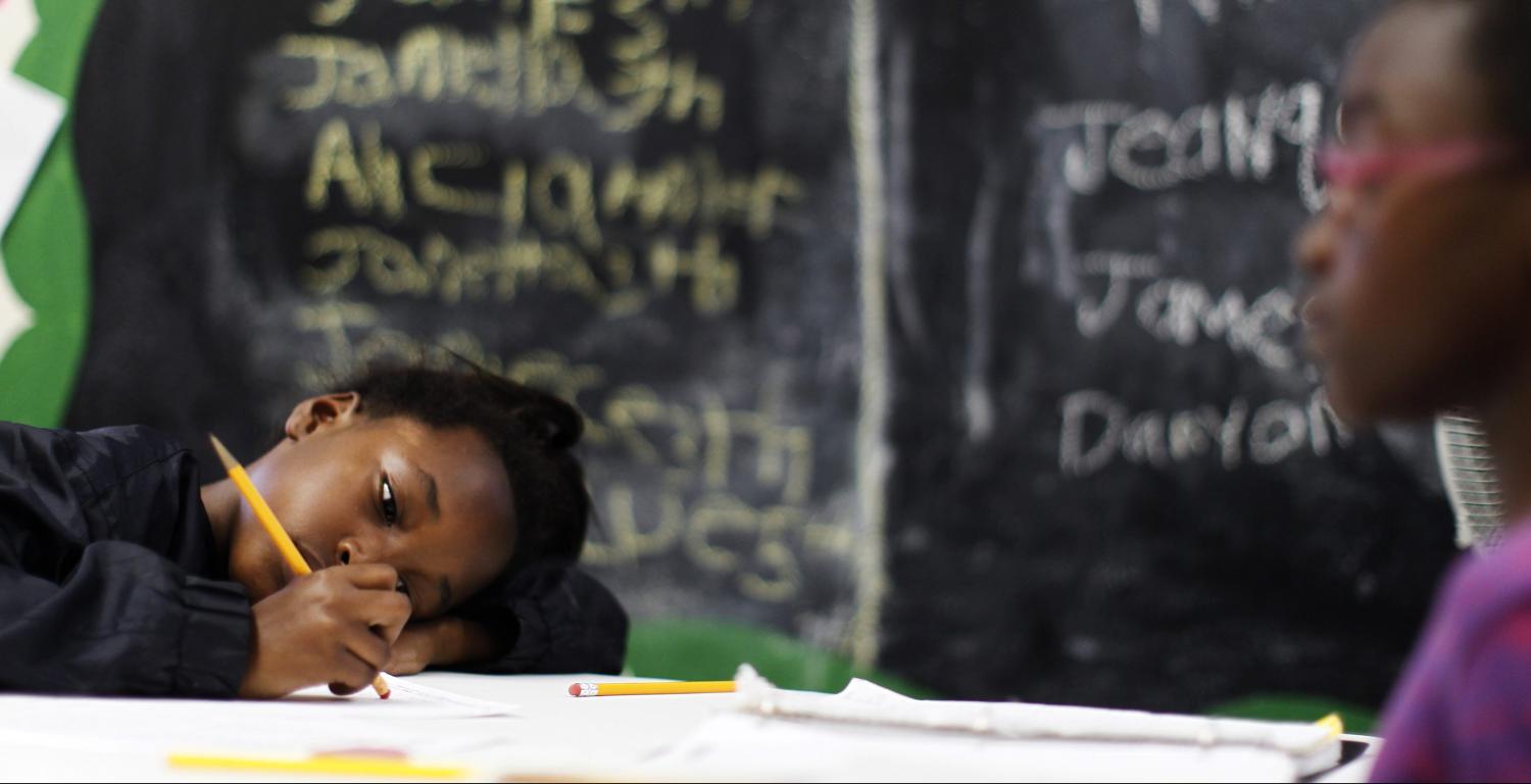 Sisters Jamie, 9, (L) and Jamella, 8, do their homework at South Los Angeles Learning Center in Los Angeles, California March 16, 2011. The center is run by School on Wheels, which uses volunteers to tutor homeless children in shelters, parks, motels, and two centers. There has been a surge in the number of homeless children in Los Angeles in the last five years, due to persistent unemployment and mounting foreclosures. REUTERS/Lucy Nicholson (UNITED STATES - Tags: EDUCATION SOCIETY)