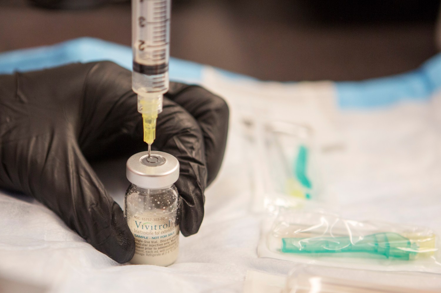 Gail Dufault, the Transitional Healthcare Coordinator at the Barnstable County House of Corrections, prepares a dose of Vivitrol at the prison in Buzzards Bay, Massachusetts September 2, 2014.  Barnstable is believed to be the first jail in the country to launch an intensive voluntary recovery program for opiate-addicted inmates with the use of Vivitrol, an injectable non-narcotic drug that blocks receptors in the brain and bars addicts from getting high off heroin and other opioids for about 25 days, at a cost of about $1,000 a shot. Picture taken  September 2, 2014.  To match Feature USA-HEROIN/PRISONS/    REUTERS/Brian Snyder (UNITED STATES - Tags: SOCIETY CRIME LAW DRUGS HEALTH)