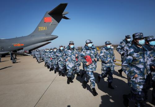 Medical personnel arrive in transport aircraft of the Chinese People's Liberation Army (PLA) Air Force at the Wuhan Tianhe International Airport following the outbreak of the novel coronavirus in Wuhan, Hubei province, China February 17, 2020. China Daily via REUTERS  ATTENTION EDITORS - THIS IMAGE WAS PROVIDED BY A THIRD PARTY. CHINA OUT.