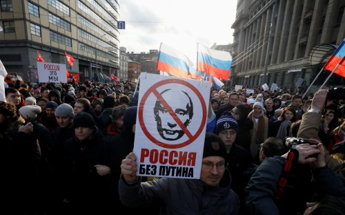 People take part in a rally to mark the 5th anniversary of Russian opposition politician Boris Nemtsov's murder and to protest against proposed amendments to the country's constitution, in Moscow, Russia February 29, 2020. The placard reads: "Russia without Putin". REUTERS/Shamil Zhumatov