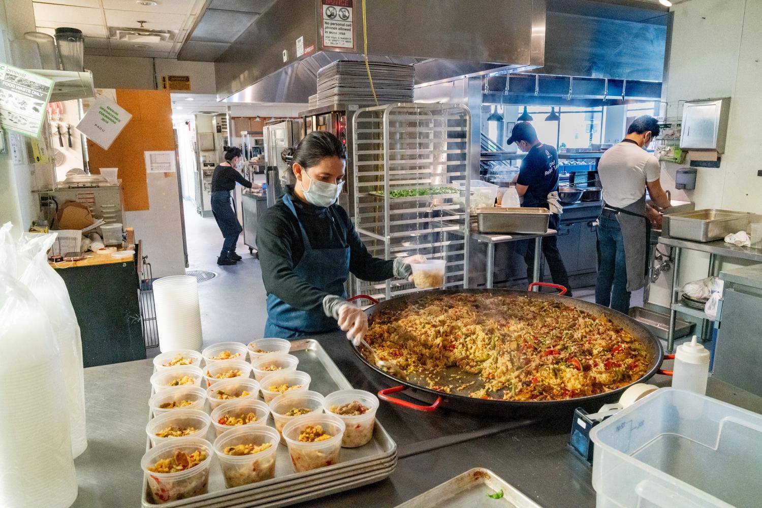 April 25, 2020, Cambridge, Massachusetts, USA:  Kitchen staffs preparing meals for frontline workers at Pagu in Cambridge.  Pagu is one of the first restaurant partners of Off Their Plate (OTP).  OTP is a brainchild of Natalie Guo, Harvard Medical student, providing relief for two hard hit industries, Health care and restaurant industries.   OTP, working with World Central Kitchen has expanded in 9 cities, working with more than 50 restaurants and 110 health care facilities across the nation and fundraised 3 million dollars since March. The organization pays restaurant $10 a meal to produce for frontline workers. The National Restaurant Association estimates that 3 million industry employees have already lost their jobs, and restaurants across USA will take a $225 billion sales hit through May .   No Use China. No Use Taiwan. No Use Korea. No Use Japan.