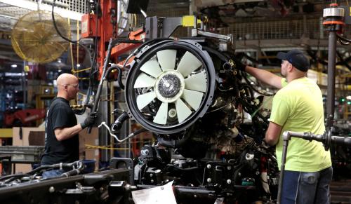 FILE PHOTO: General Motors assembly workers attach the engine to the chassis of Chevrolet 2019 heavy-duty pickup trucks at General Motors Flint Assembly Plant in Flint, Michigan, U.S. February 5, 2019.      REUTERS/Rebecca Cook/File Photo