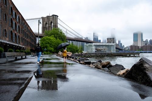 A girl wearing a protective mask is seen in Brooklyn Bridge Park during the coronavirus disease (COVID-19) outbreak in the Brooklyn borough of New York City, U.S., May 23, 2020. REUTERS/Jeenah Moon     TPX IMAGES OF THE DAY