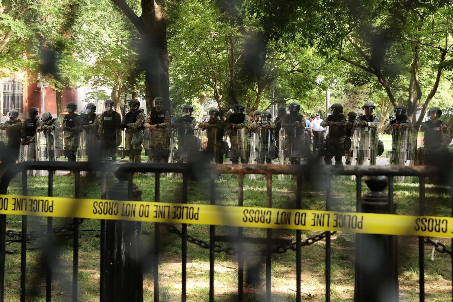 DC National Guard Military Police officers stand guard behind a fence surrounding Lafayette Park outside the White House as protests continue over the death in police custody of George Floyd, in Washington, U.S., June 2, 2020. REUTERS/Jonathan Ernst
