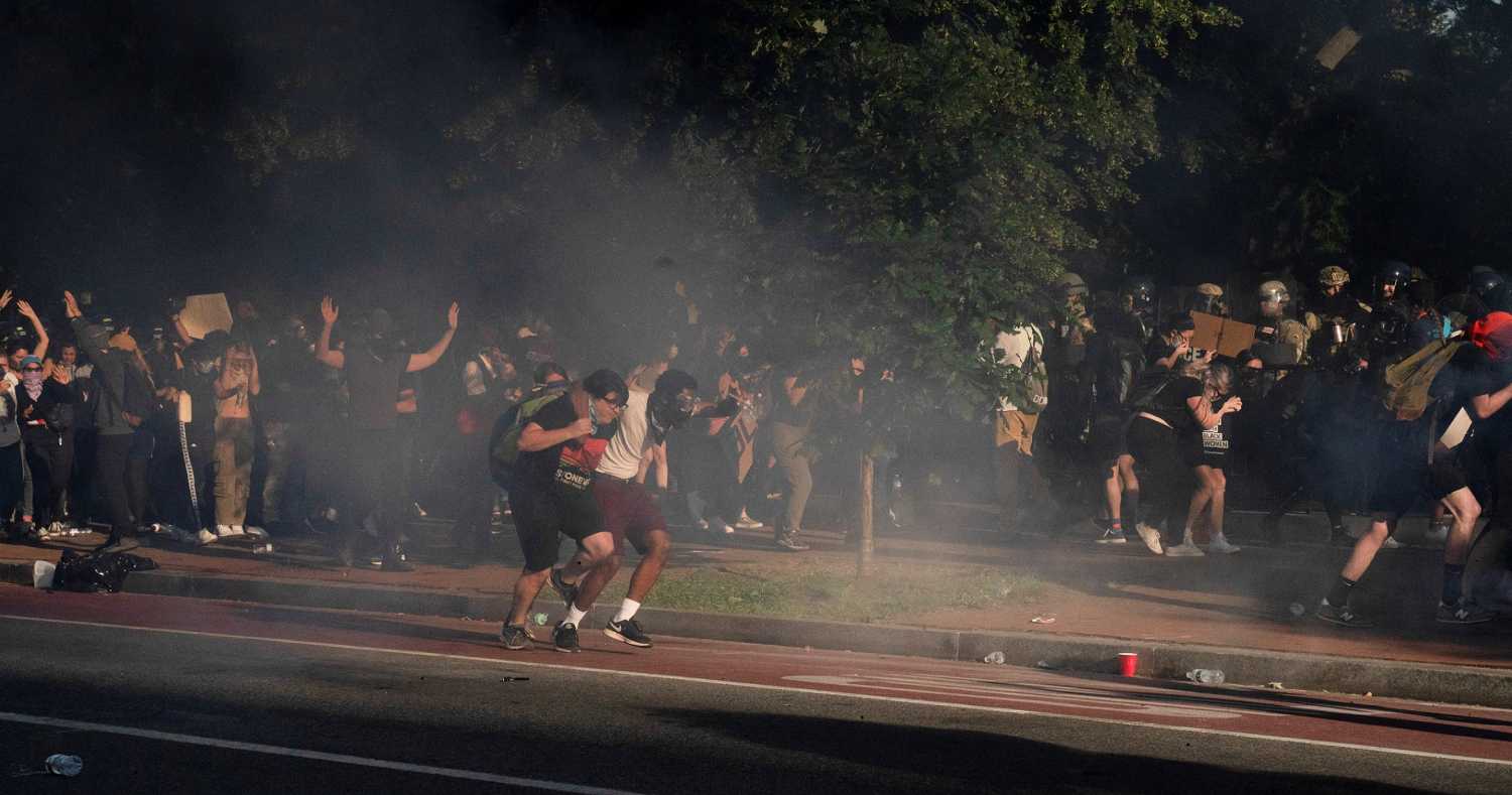 Protestors run as riot police fire tear gas and move on demonstrators to clear Lafayette Park and the area around it across from the White House for President Donald Trump to be able to walk through for a photo opportunity in front of St. John's Episcopal Church, during a rally against the death in Minneapolis police custody of George Floyd, near the White House, in Washington, U.S. June 1, 2020. REUTERS/Ken Cedeno     TPX IMAGES OF THE DAY