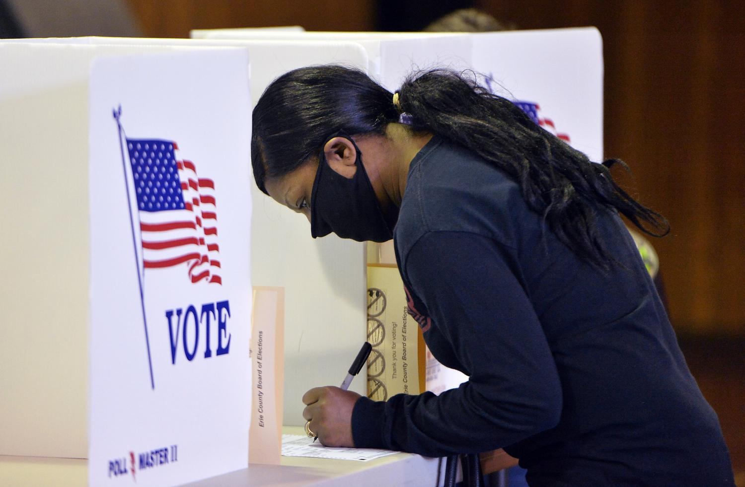 Jun 2, 2020; Erie, PA, USA; Voter Kelli Gambill, 42, fills out her ballot at the Jefferson Education Society polling place on June 2, 2020, in Erie. Pennsylvania's primary election was postponed from April 28 because of COVID-19 concerns.  Mandatory Credit: Greg Wohlford/Erie Times-News via USA TODAY NETWORK