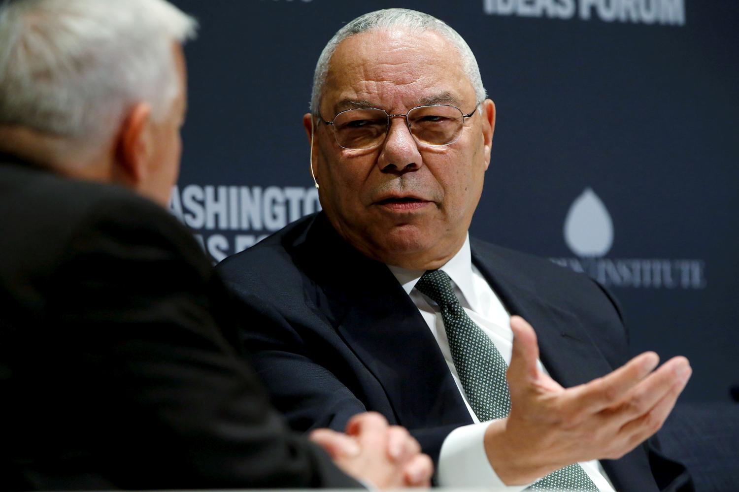 FILE PHOTO: Former U.S. Secretary of State Colin Powell (R) takes part in an onstage interview with Aspen Institute President and CEO Walter Isaacson (L) at the Washington Ideas Forum in Washington, September 30, 2015. REUTERS/Jonathan Ernst/File Photo