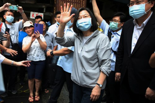 Taiwan President Tsai Ing-wen waves to the crowd in Keelung, Taiwan, June 9, 2020. REUTERS/Ann Wang
