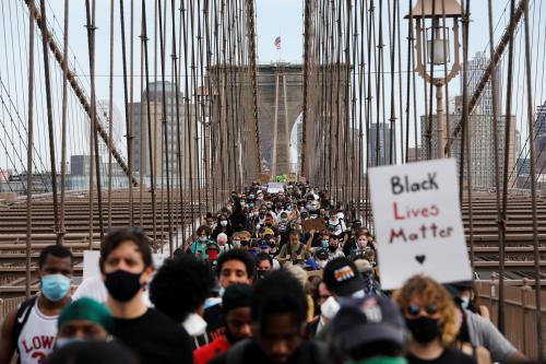 Demonstrators march across Brooklyn Bridge in protest against the death in Minneapolis police custody of George Floyd in the Brooklyn borough of New York City, New York, U.S., June 4, 2020. REUTERS/Andrew Kelly