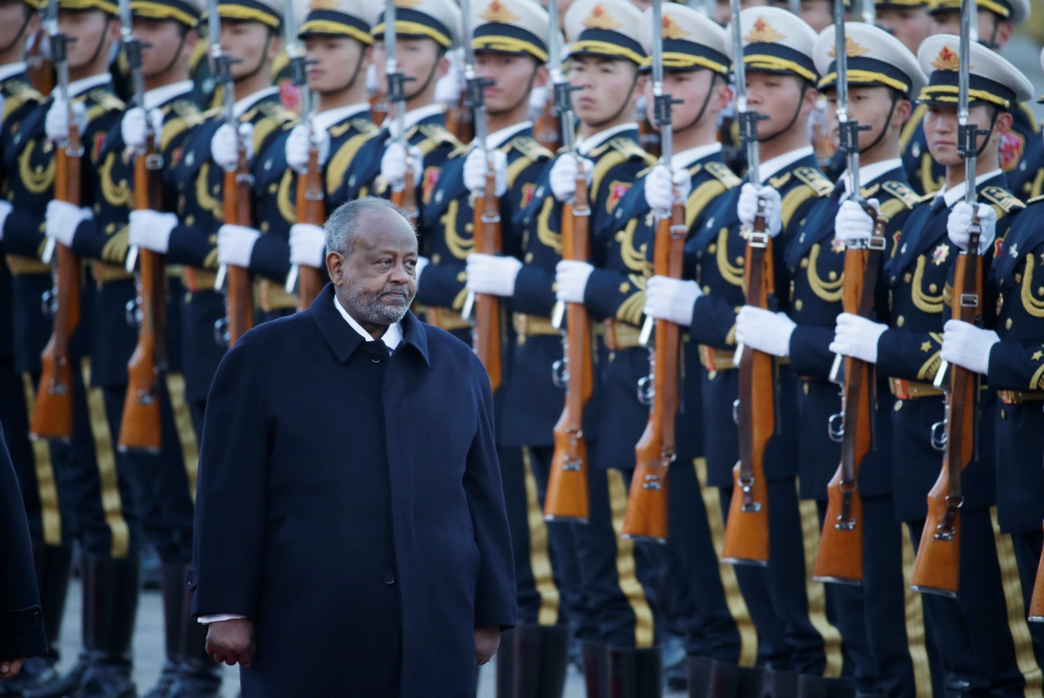 Djibouti's President Ismail Omar Guelleh inspects the honour guard with Chinese President Xi Jinping during a welcoming ceremony at the Great Hall of the People in Beijing, China November 23, 2017. REUTERS/Jason Lee