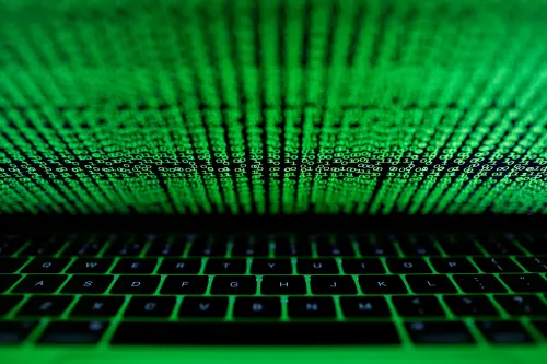 FILE PHOTO: A computer keyboard lit by a displayed cyber code is seen in this illustration picture taken on March 1,  2017. REUTERS/Kacper Pempel/Illustration/File Photo