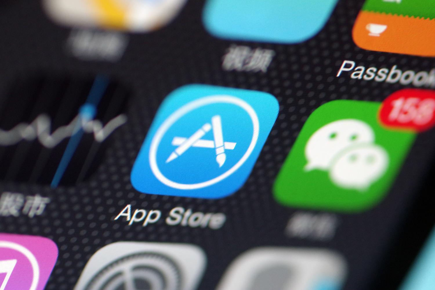--FILE--A Chinese mobile phone user shows the icons of App Store app, left, and messaging app Weixin, or WeChat, of Tencent on his iPhone smartphone in Ji'nan city, east China's Shandong province, 27 June 2017.Apple China said it will not take the blame for developers who charge differently on the iOS app and Android versions for the same product or service. Netizens have found they need to pay more on iOS than Android in using the same ride-sharing or video subscription services. Some Internet companies have reportedly adopted differential pricing plans through the use of Big Data based on a customer's buying behavior or interest, so a new customer may pay less than an old customer for the same product or service.No Use China. No Use France.