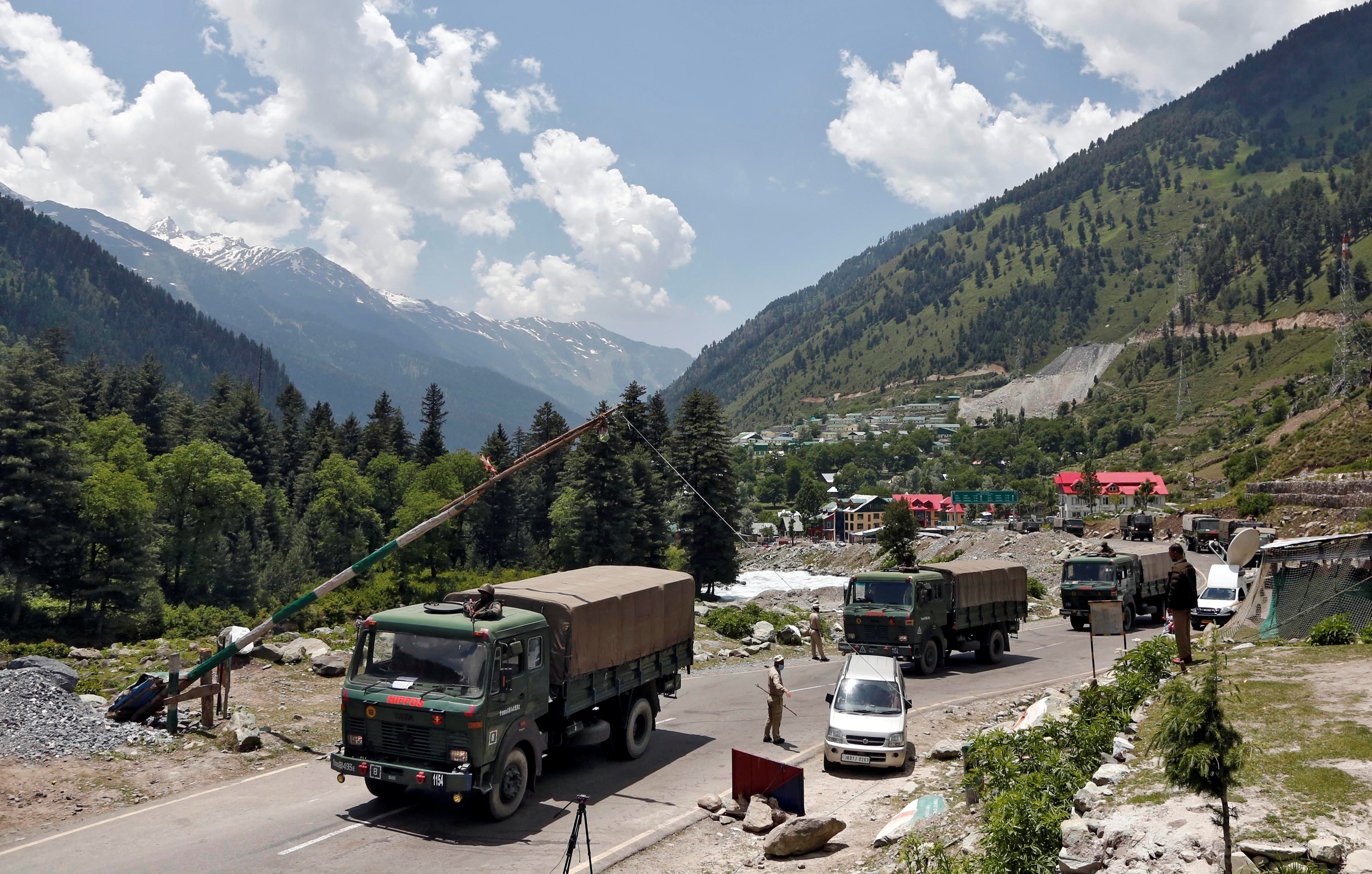 Indian army trucks move along a highway leading to Ladakh, at Gagangeer in Kashmir's Ganderbal district June 17, 2020. REUTERS/Danish Ismail