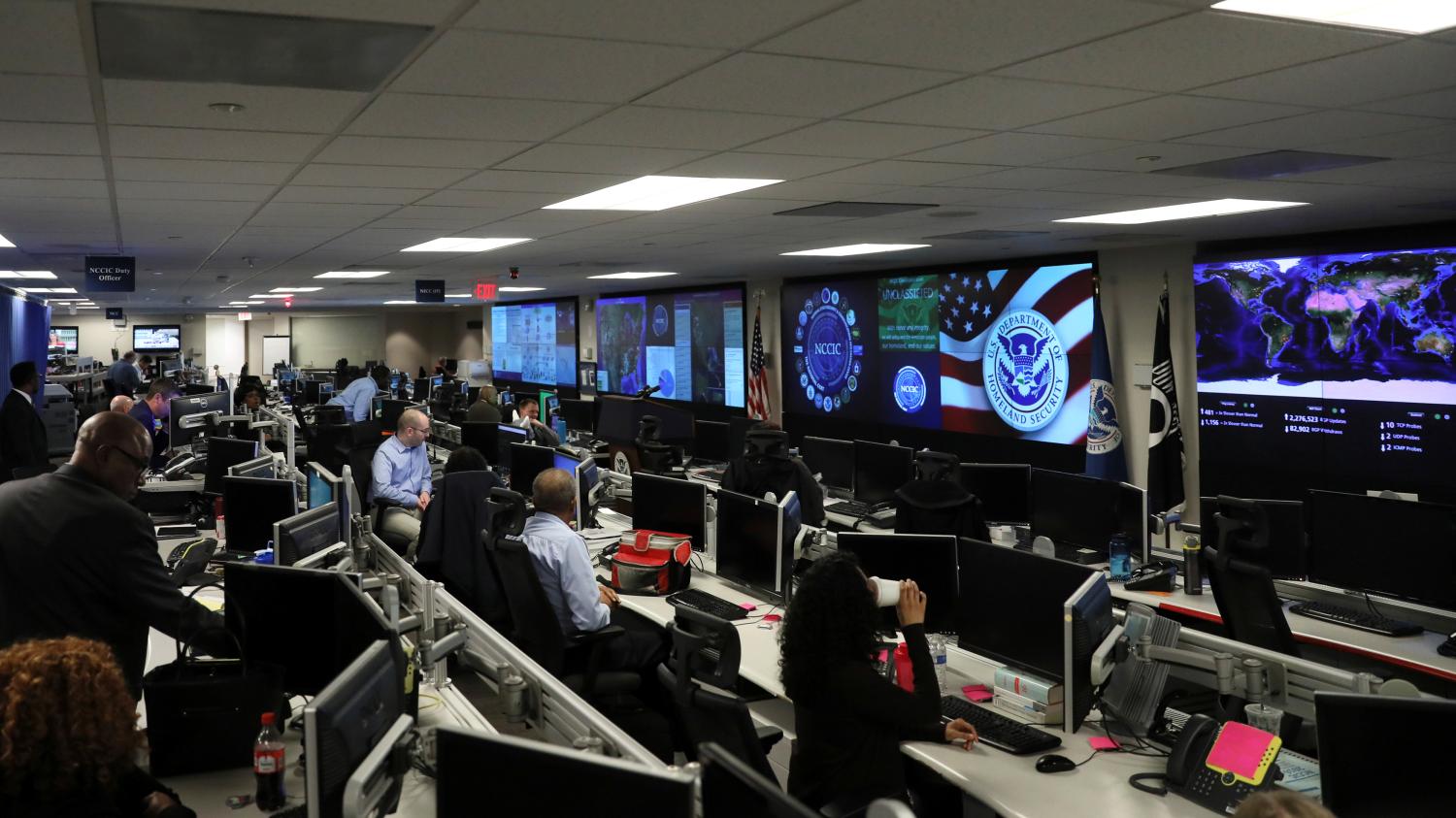 U.S. Department of Homeland Security election security workers monitor screens in the DHS National Cybersecurity and Communications Integration Center (NCCIC) in Arlington, Virginia, U.S. November 6, 2018. REUTERS/Jonathan Ernst