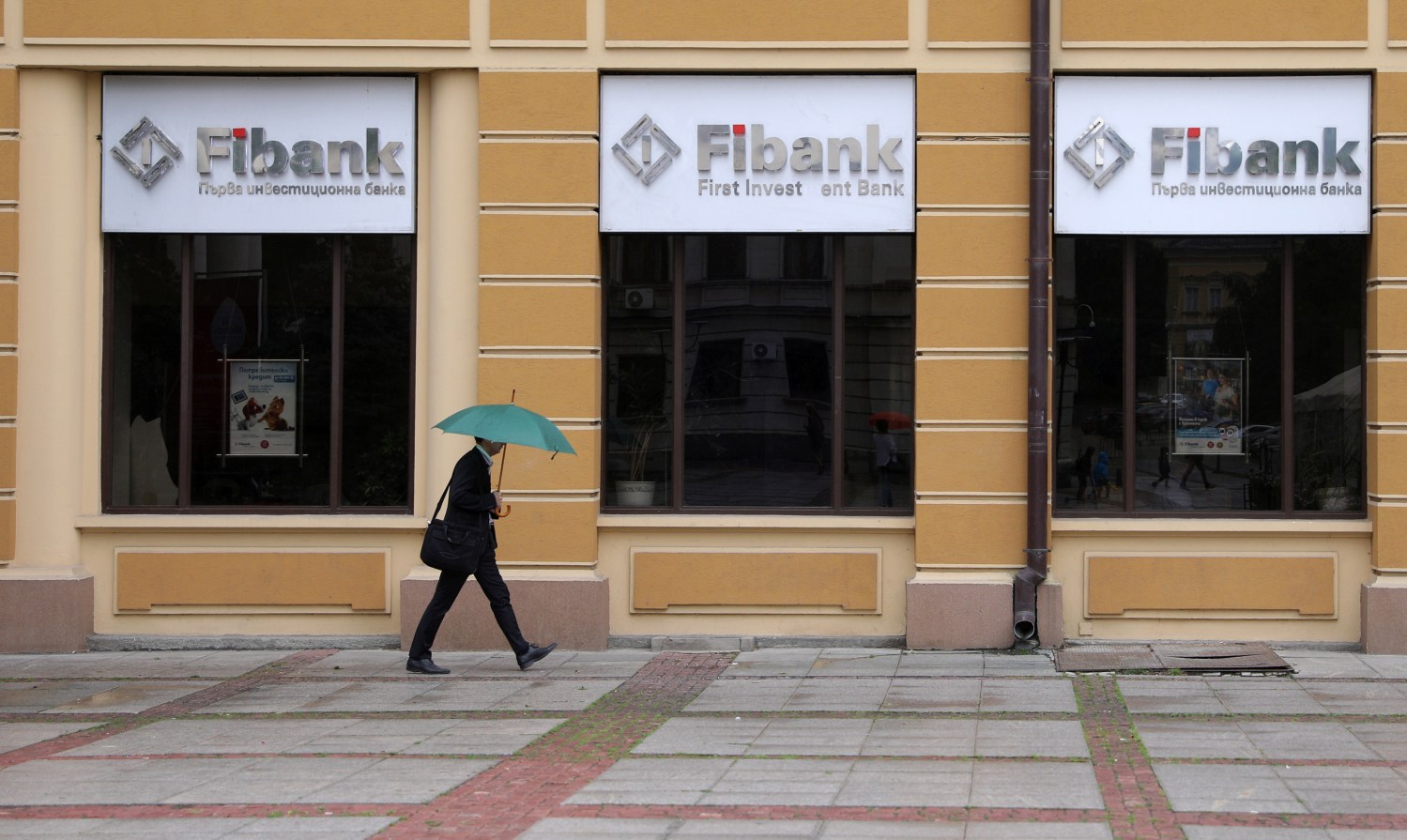 A man walks in front of an office of First Investment Bank (Fibank) in Sofia, Bulgaria, June 12, 2020. REUTERS/Stoyan Nenov