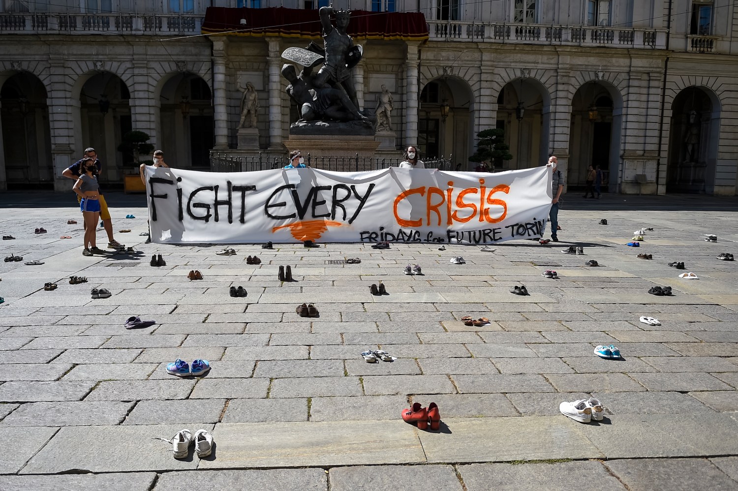 TURIN, ITALY - June 05, 2020: Protesters hold a banner reading 'Fight every crisis' during a Fridays for future demonstration, a worldwide climate strike against governmental inaction towards climate breakdown and environmental pollution. (Photo by Nicolò Campo/Sipa USA)No Use UK. No Use Germany.