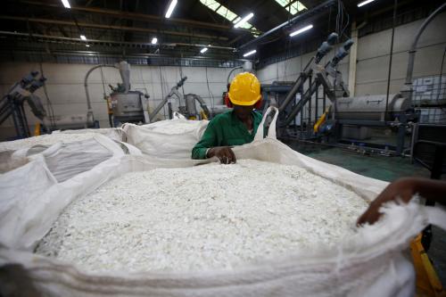 An employee examines recycled plastic flakes after a wet recycle process at the Mr.Green plastic recycling factory in Nairobi, Kenya, June 25, 2018. Picture taken June 25, 2018.REUTERS/Baz Ratner