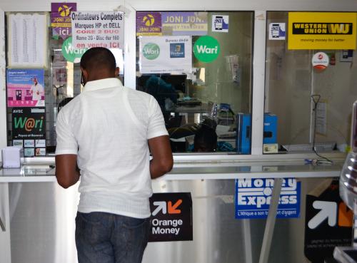 A customer at a money transfer point that offers money transfer services through Wari and other transfer companies in Dakar, Senegal March 15, 2017.  Picture taken March 15, 2017.  REUTERS/Nellie Peyton