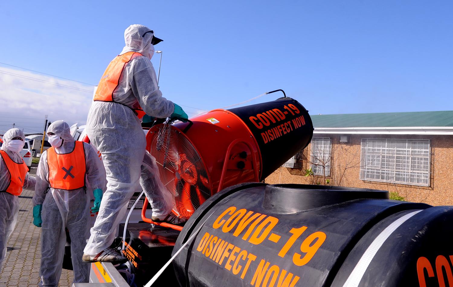 CAPE TOWN, SOUTH AFRICA-Janitorial workers perform disinfection tasks at a school in Cape Town, South Africa on June 25, 2020. The "Covid-19 Disinfect" group launched a pilot program to disinfect the city, starting with schools , ensuring the slowdown of coronavirus transmission in these institutions. The machinery used for disinfection can disperse disinfectant up to a range of 2,500 meters through 365 degrees, ensuring disinfection in schools, taxi stands and other public spaces in the city. (NO RESALE)