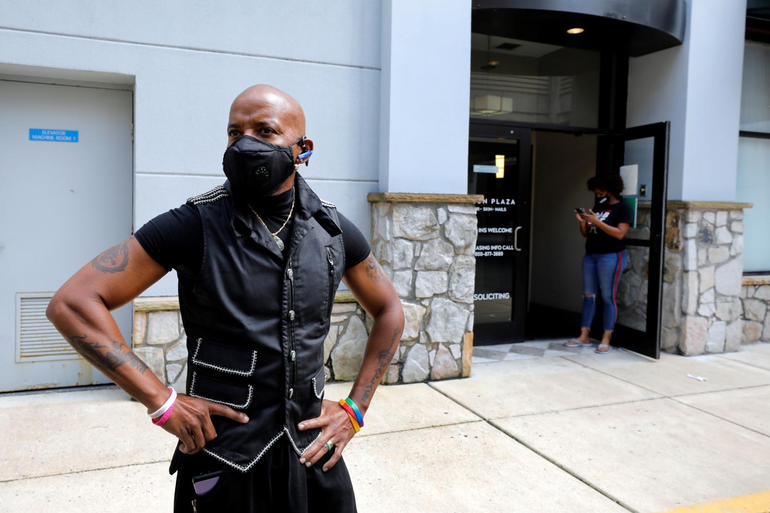 Gary Connell reacts while talking about the economic impact to his hairstyling business after a nine-week disruption due to the stay-at-home order for the coronavirus disease (COVID-19) outbreak, outside Salon Plaza in Wheaton, Maryland, near Washington, U.S., June 11, 2020. Picture taken June 11, 2020. REUTERS/Yuri Gripas