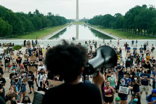 Protesters applaud during a rally against racial inequality in the aftermath of the death in Minneapolis police custody of George Floyd, at the Lincoln Memorial in Washington, U.S., June 10, 2020. REUTERS/Erin Scott