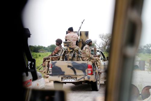 A Nigerian army convoy vehicle drives ahead with an anti-aircraft gun, on its way to Bama, Borno State, Nigeria August 31, 2016. Picture taken from inside a vehicle. REUTERS/Afolabi Sotunde       SEARCH "BAMA" FOR THIS STORY. SEARCH "WIDER IMAGE" FOR ALL STORIES.