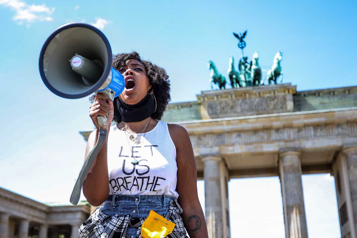 People demonstrate in commemoration of George Floyd near the American embassy at Pariser Platz in Berlin, Germany, May 31, 2020. About 200 people gathered in front of the Brandenburg Gate in the German capital to protest against police brutality racism and hate. 46-year-old African-American, George Floyd died on May 25, 2020 after a Minneapolis police officer was kneeling on his neck for several minutes during his arrest. The controversial act of police brutality sparked violent demonstrations throughout the U.S with reports of riots in Minnesota, California, New-York and more. Reports also mention that Derek Chauvin, one of the police officers allegedly involved in the incident was arrested and will be charged with Third-degree murder. (Photo by: Omer Messinger)No Use UK. No Use Germany.