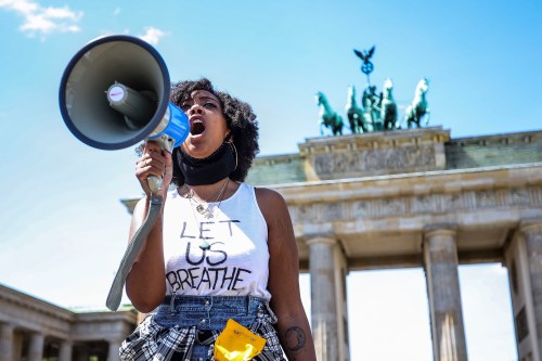 People demonstrate in commemoration of George Floyd near the American embassy at Pariser Platz in Berlin, Germany, May 31, 2020. About 200 people gathered in front of the Brandenburg Gate in the German capital to protest against police brutality racism and hate. 46-year-old African-American, George Floyd died on May 25, 2020 after a Minneapolis police officer was kneeling on his neck for several minutes during his arrest. The controversial act of police brutality sparked violent demonstrations throughout the U.S with reports of riots in Minnesota, California, New-York and more. Reports also mention that Derek Chauvin, one of the police officers allegedly involved in the incident was arrested and will be charged with Third-degree murder. (Photo by: Omer Messinger)No Use UK. No Use Germany.