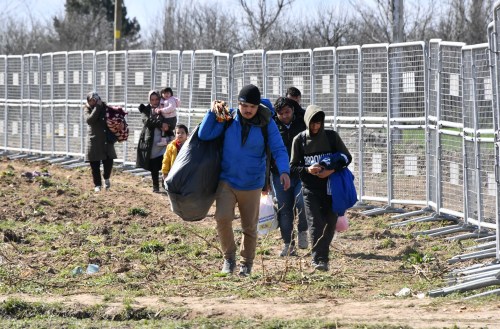 EDIRNE, TURKEY- In the photos, immigrants are seen near the border of Turkey with Greece in the province of Edirne, Turkey, on March 3, 2020. Thousands of Syrian refugees are anxiously waiting to cross into Europe from Turkey, on the border Northwest with Greece.