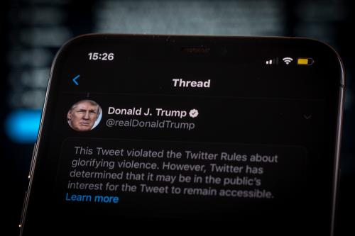 A tweet by US president Donald Trump is seen being flagged as inciting violence by Twitter in this photo illustration on an Apple iPhone in Warsaw, Poland on May 29, 2020. Twitter on May 29 applied a fact-checking label to a vote-in-mail tweet by US President Donald Trump that the company considers misleading. Twitter has recently started labelling tweets with public notification and fact check labels. The labelling of Trump's tweet about the uproar following the death of George Floyd has seen the president signing an executive order targeting the Communications Decency Act. Section 230 which protects social media companies against lawsuits against them for user generated content. (Photo by Jaap Arriens / Sipa USA)No Use UK. No Use Germany.