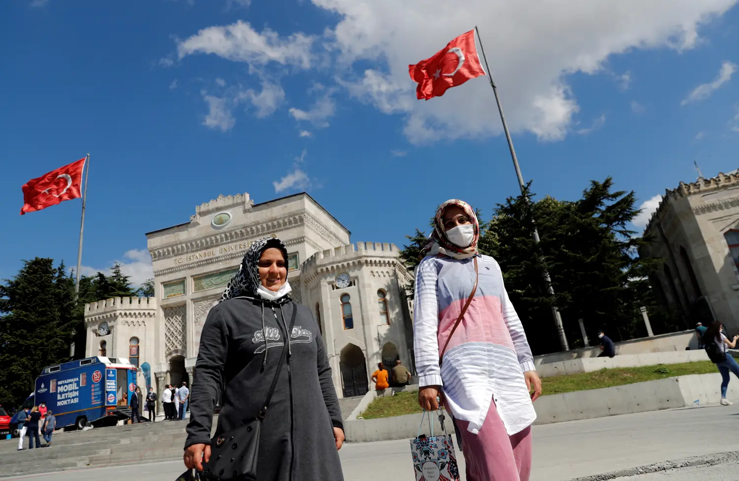 Parents wait outside the main campus of the Istanbul University while their children take the national university entrance exams, amid the spread of the coronavirus disease (COVID-19), in Istanbul, Turkey June 27, 2020. REUTERS/Murad Sezer