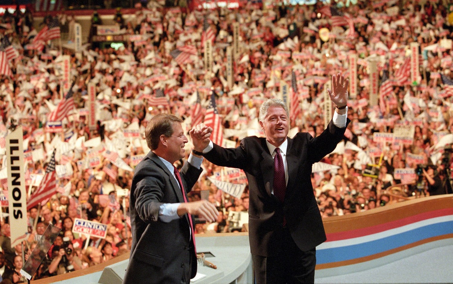 President Bill Clinton raises his hand with Vice President Gore after his acceptance speech at the Democratic National convention August 29, 1996 at Chicago's United Center.  President Clinton urged Americans Thursday to march with him into the 21st Century with an agenda that disdains the "old politics of Washington."  Reuters/Win McNamee BEST QUALITY AVAILABLE