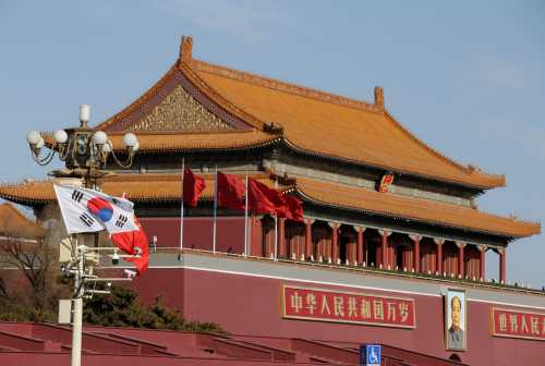South Korea and China's flags flutter next to Tiananmen Gate during the visit of South Korean President Moon Jae-In in Beijing, China December 15, 2017. REUTERS/Jason Lee