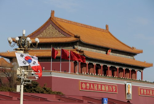 South Korea and China's flags flutter next to Tiananmen Gate during the visit of South Korean President Moon Jae-In in Beijing, China December 15, 2017. REUTERS/Jason Lee