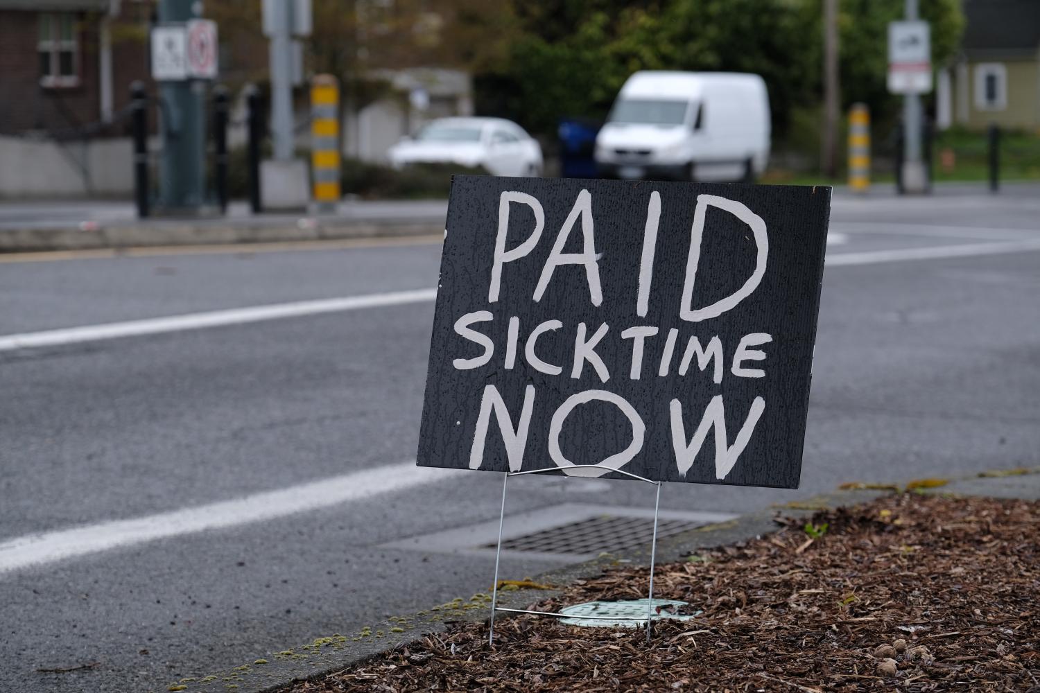 A sign calling for paid sick time pictured on North Interstate Avenue in Portland, Ore., on March 27, 2020, as the state continues to urge the importance of stricter social distancing measures to combat the novel coronavirus. (Photo by Alex Milan Tracy/Sipa USA)No Use UK. No Use Germany.