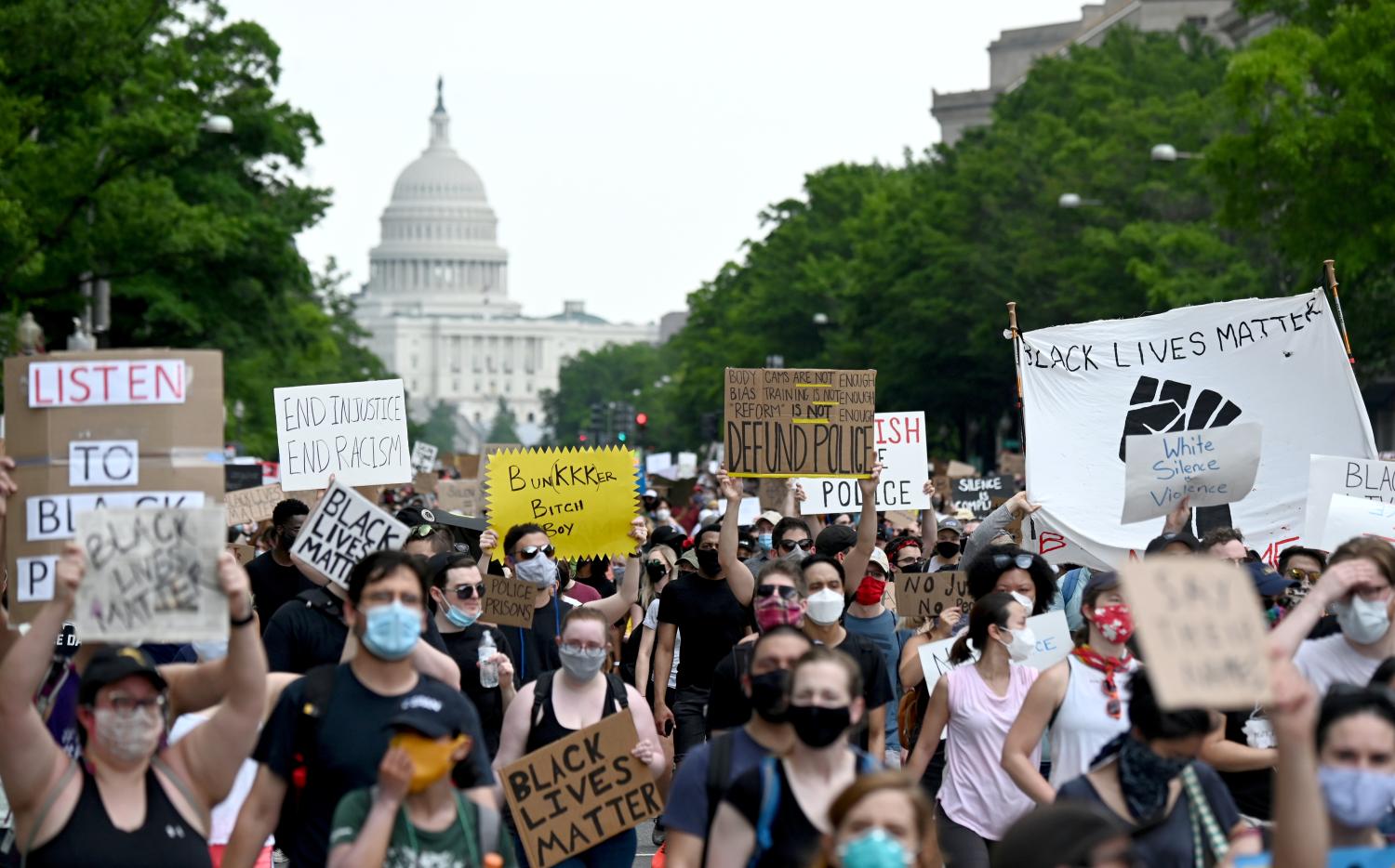 FILE PHOTO: Demonstrators march from the U.S. Capitol Building during a protest against racial inequality in the aftermath of the death in Minneapolis police custody of George Floyd, in Washington, U.S., June 6, 2020. REUTERS/Erin Scott/File Photo