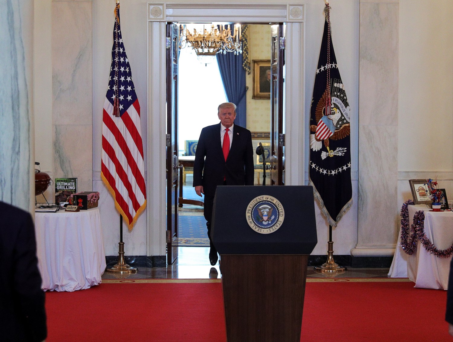 U.S. President Donald Trump arrives for a "Spirit of America Showcase" event in the Cross Hall of the White House in Washington, U.S., July 2, 2020. REUTERS/Tom Brenner