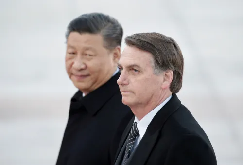 FILE PHOTO: Chinese President Xi Jinping and Brazilian President Jair Bolsonaro attend a welcoming ceremony at the Great Hall of the People in Beijing, China, October 25, 2019. REUTERS/Jason Lee/File Photo