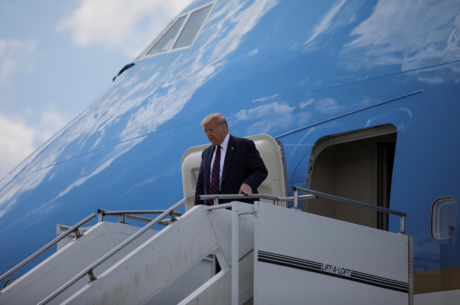 U.S. President Donald Trump steps from Air Force One as he arrives at Raleigh-Durham International Airport in Morrrisville, North Carolina, U.S., July 27, 2020. REUTERS/Carlos Barria