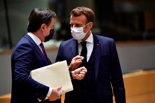 Italian Prime Minister Giuseppe Conte and France's President Emmanuel Macron speak during the first face-to-face EU summit since the coronavirus disease (COVID-19) outbreak, in Brussels, Belgium July 20, 2020. John Thys/Pool via REUTERS