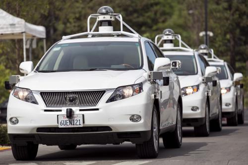 A line of Lexus SUVs equipped with Google self-driving sensors await test riders during a media preview of Google's prototype autonomous vehicles in Mountain View, California September 29, 2015.  REUTERS/Elijah Nouvelage