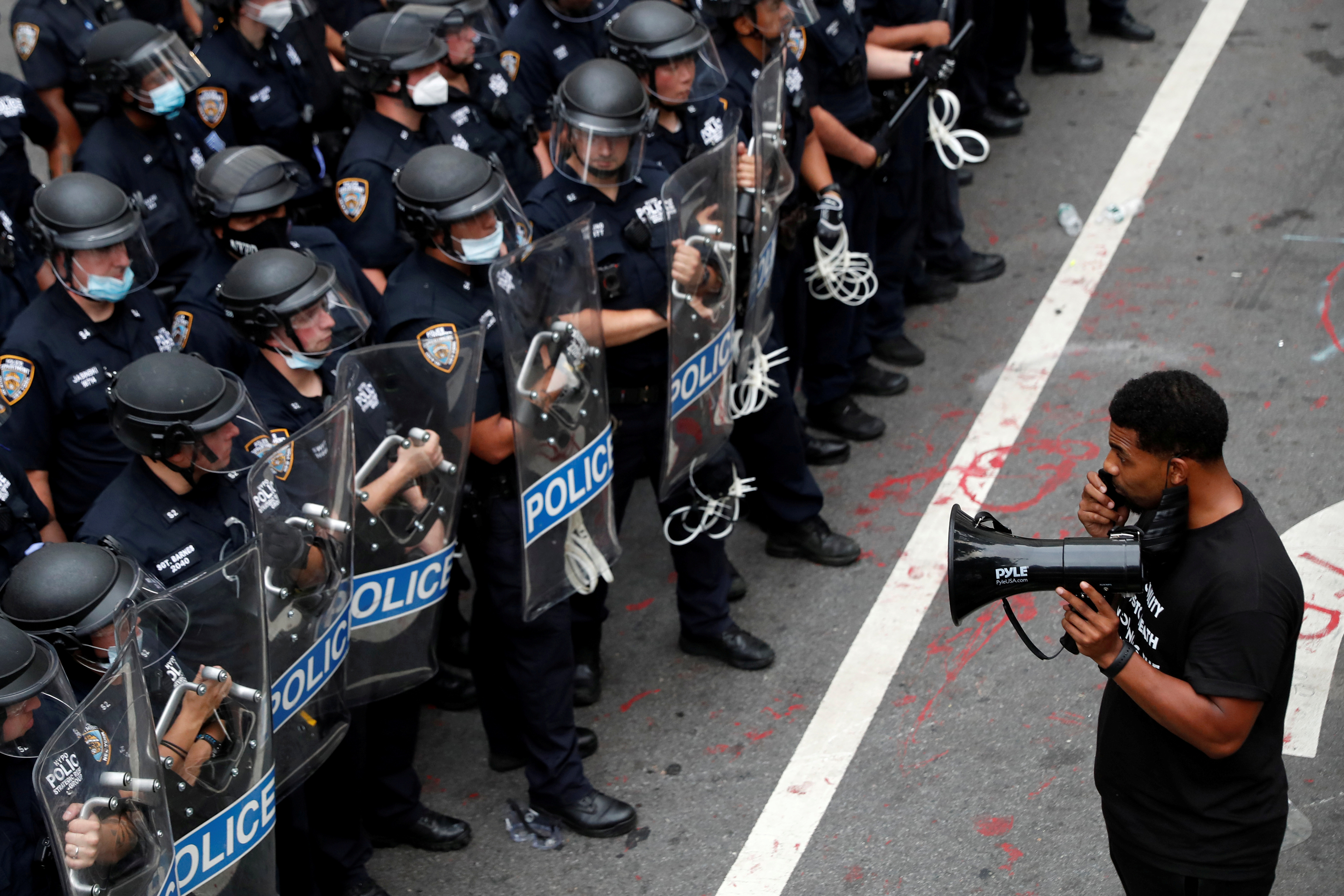 A demonstrator stands in front of New York Police Department (NYPD) officers inside of an area being called the "City Hall Autonomous Zone" that has been established to protest the New York Police Department and in support of "Black Lives Matter" near City Hall in... </p>
<p><a href=