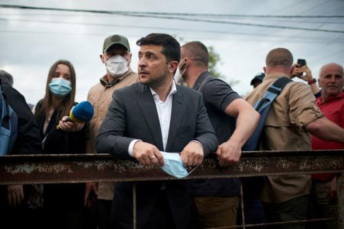 FILE PHOTO: Ukrainian President Volodymyr Zelenskiy visits a settlement affected by heavy rainfall and flooding in Ivano-Frankivsk Region, Ukraine June 25, 2020. Picture taken June 25, 2020. Ukrainian Presidential Press Service/Handout via REUTERS ATTENTION EDITORS - THIS IMAGE WAS PROVIDED BY A THIRD PARTY./File Photo