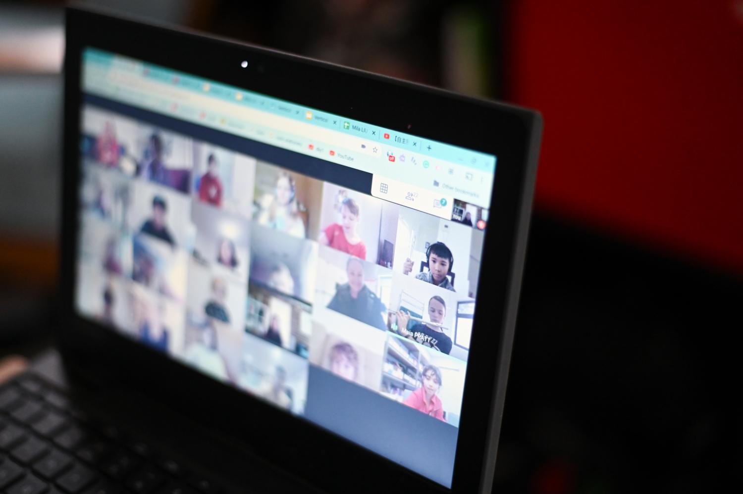 Members of a Primary school band are seen on a screen during an online lesson via Zoom in Canberra, Wednesday, April 29, 2020. (AAP Image/Lukas Coch) NO ARCHIVINGNo Use Australia. No Use New Zealand.