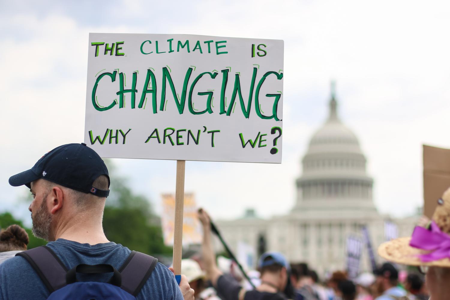 Washington, DC - April 29, 2017: Thousands of people attend the People's Climate March to stand up against climate change. By Nicole Glass Photography